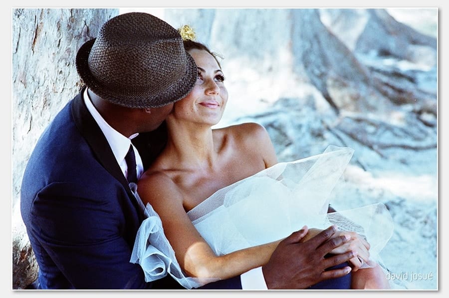 small fishing-village character — colorful boats, weathered docks, quiet streets | Caribbean coast — turquoise water with the brightest sand-water contrast in the region | reef just offshore — the snorkeling-ready water lies behind the camera for ocean ceremony frames