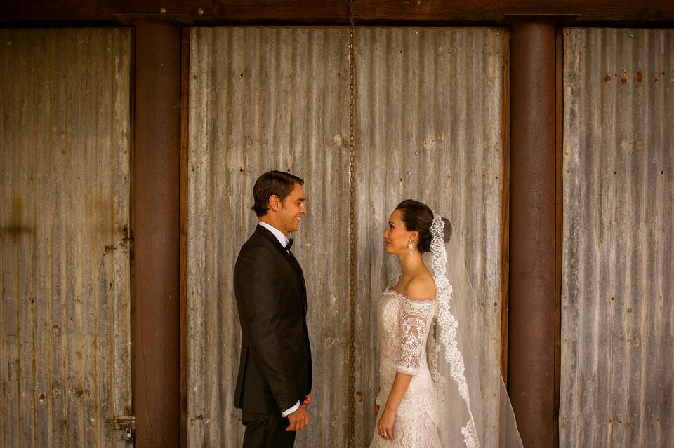 Couple embracing at the rustic Casa de Piedra outbuildings, Ruta del Vino