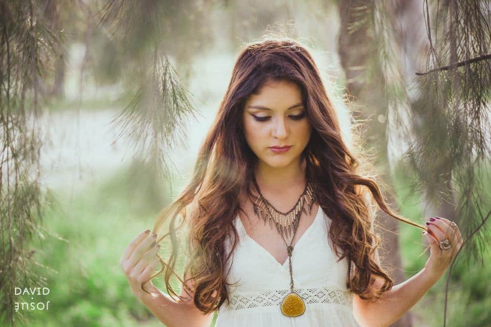 a teen portrait session documents a specific moment — birthday, milestone, sweet sixteen, quinceanera | the photograph reads who the young person is now, not who they're becoming | the camera works the location's natural light rather than a styled studio setup