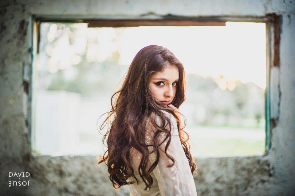 natural light frames the body cleanly in painterly tones | the location's character reads as part of the photograph rather than as backdrop | gesture and expression — not directed poses — carry the photograph