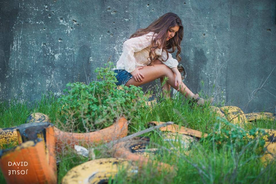 natural light frames the body cleanly in painterly tones | the location's character reads as part of the photograph rather than as backdrop | gesture and expression — not directed poses — carry the photograph