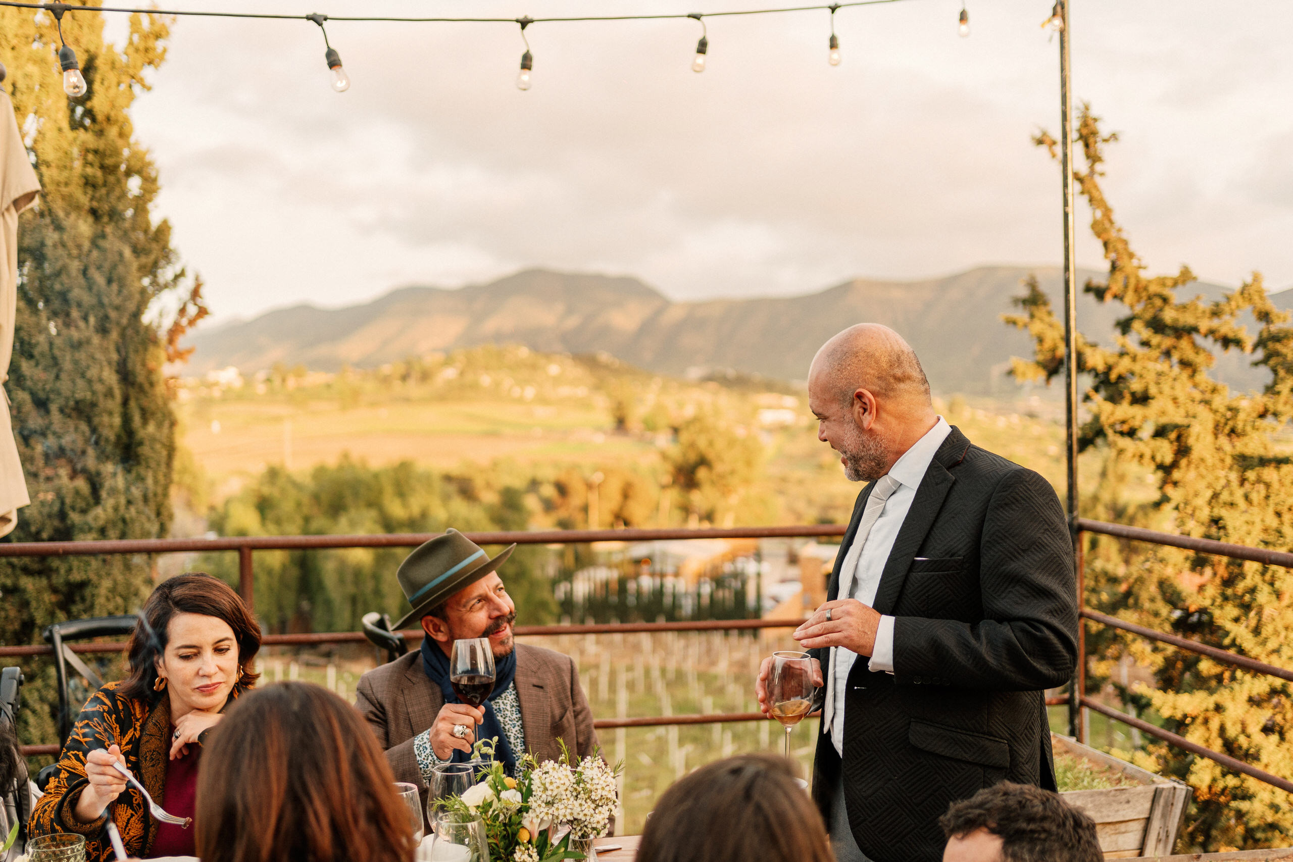 Chef Benito Molina (Manzanilla, Silvestre, Amapola) embracing the groom Alfredo Villanueva at the Conchas de Piedra reception