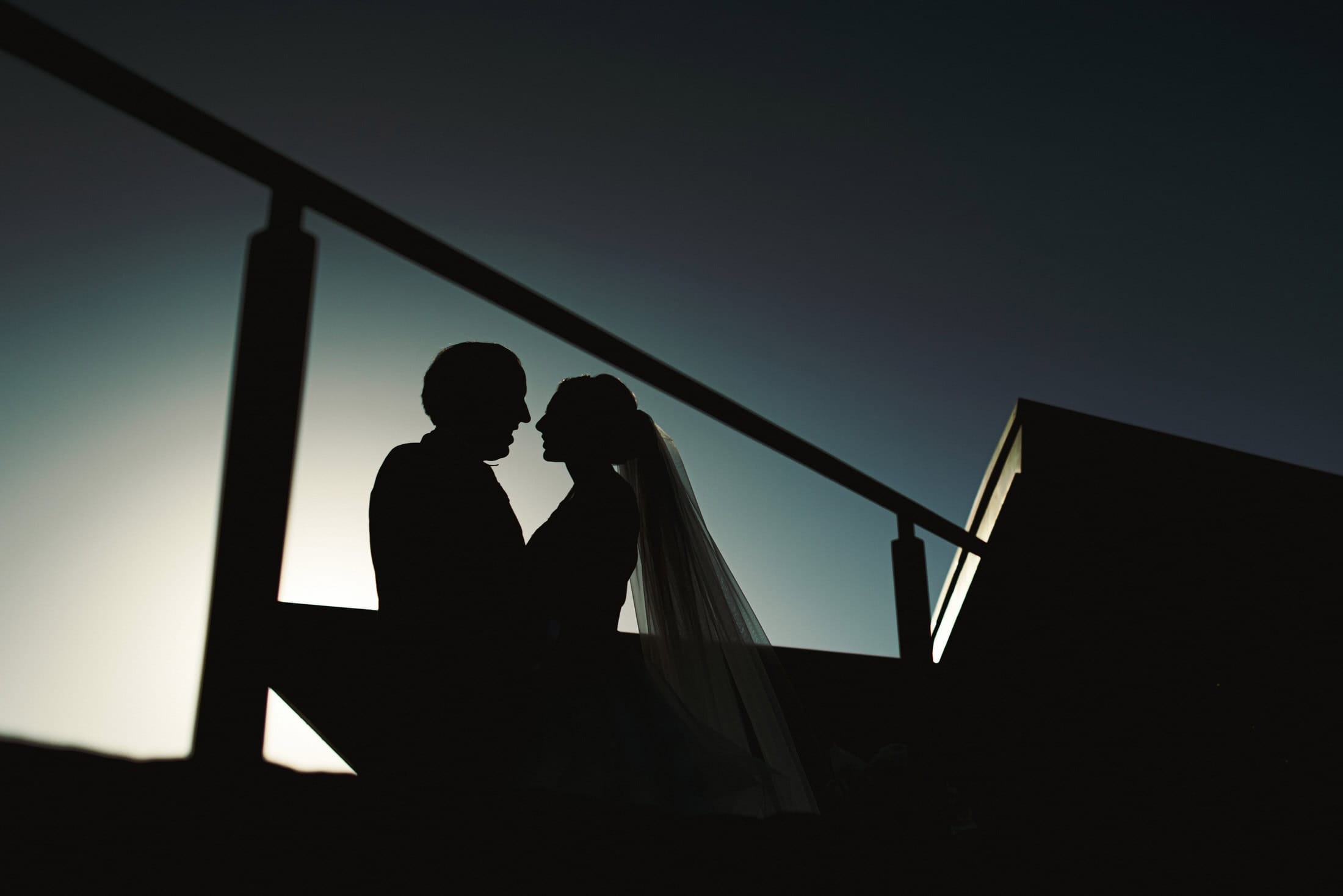 calm direction — no shot list, no choreography, no performing for the camera | I scout the property's architectural lines and the vineyard's geometry before the day | 25+ years photographing weddings in Mexico, Europe, and several other countries