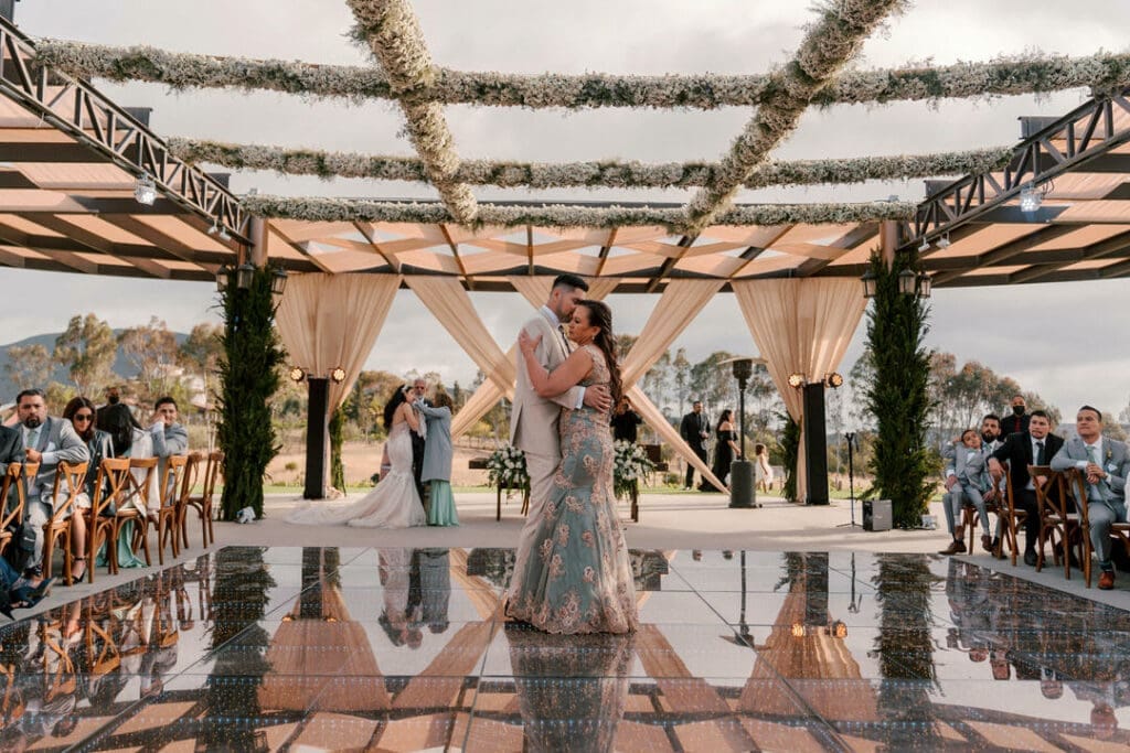 late-afternoon sun rakes between cypress rows — verify exact compass orientation against satellite | terra-cotta walls bounce a warm fill into ceremony portraits during the final hour before sunset | golden hour in Valle de Guadalupe is short, dry, and decisive — the photographer plans around it, never against it