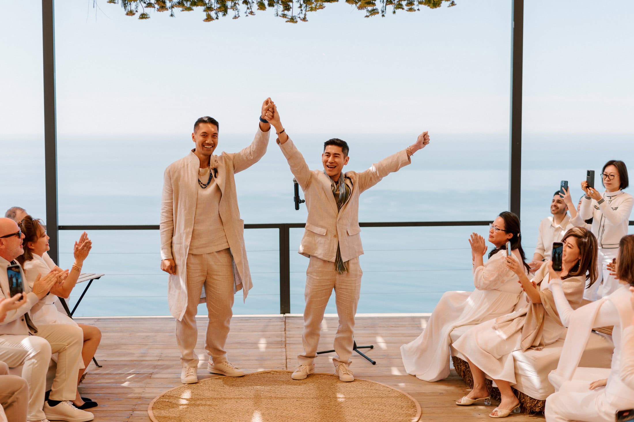 cliff-edge ceremony space — open sky, distant horizon, ocean exposure below | vineyard terrain on the inland side of the property provides receding-line geometry during golden hour | wind picks up on cliff-edge venues — schedule timing matters more here than at sheltered Valle properties