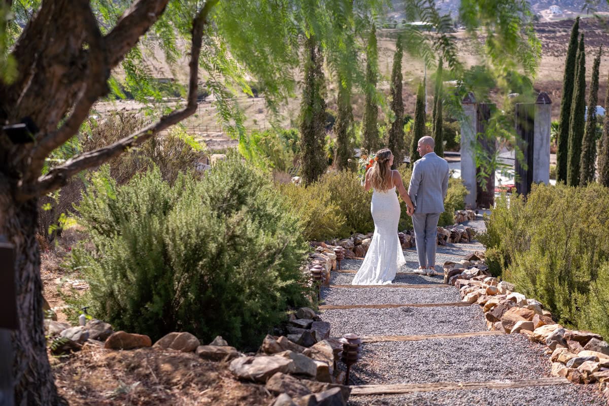 boutique resort architecture — warmer surfaces against working vineyards | on-site restaurant and lodging support multi-day wedding celebrations | vineyard surroundings deliver receding-line geometry during golden hour